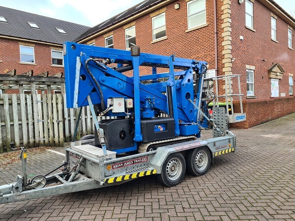 image of a cherry picker in warrington mt a large house
